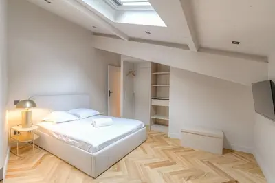 Un ou plusieurs lits dans un hébergement de l'établissement Charmant appartement en duplex pour 4, St-Didier