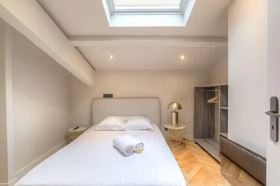 Un ou plusieurs lits dans un hébergement de l'établissement Charmant appartement en duplex pour 4, St-Didier