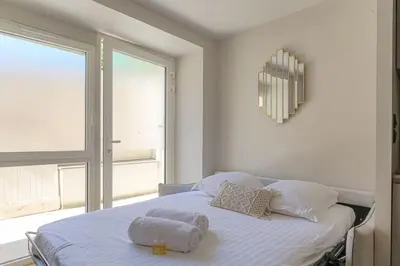 Un ou plusieurs lits dans un hébergement de l'établissement Studio with sleeping area for 4, Saint-Didier