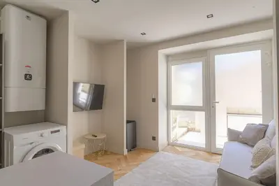 Un ou plusieurs lits dans un hébergement de l'établissement Studio with sleeping area for 4, Saint-Didier