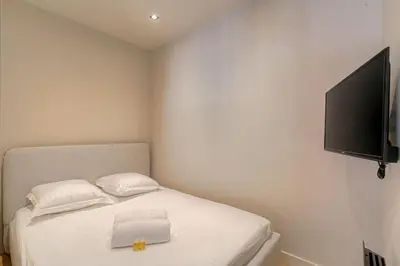 Un ou plusieurs lits dans un hébergement de l'établissement Studio with sleeping area for 4, Saint-Didier