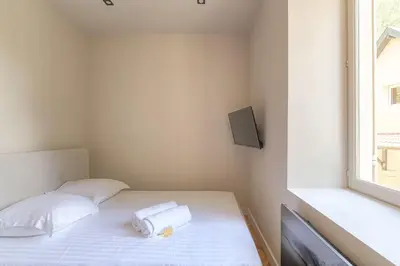 Un ou plusieurs lits dans un hébergement de l'établissement Superbe appartement, deux chambres, St-Didier