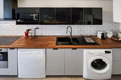 Cuisine ou kitchenette dans l'établissement Cosy Charpennes