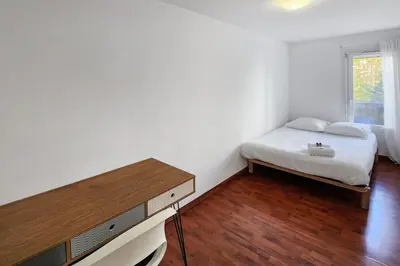 Un ou plusieurs lits dans un hébergement de l'établissement Cosy Charpennes