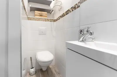 Salle de bains dans l'établissement Le Petit Enclos - Appt climatisé parking privé