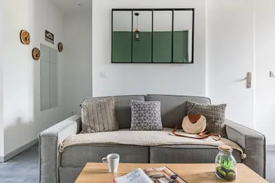 Coin salon dans l'établissement Le Louisa - Cosy et chic 30 min LYON