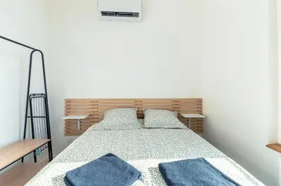 Un ou plusieurs lits dans un hébergement de l'établissement Chaleureux appartement T2 au calme et climatisé proximite centre lyon