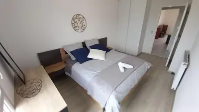 Un ou plusieurs lits dans un hébergement de l'établissement Le Barbusse LYON-T3-Garage-Terrasse-3 lits-Home Cinema