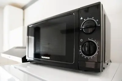Cuisine ou kitchenette dans l'établissement T2 cosy et moderne proche Confluence