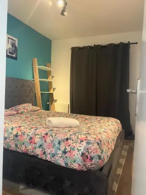 Un ou plusieurs lits dans un hébergement de l'établissement Cosy appartement