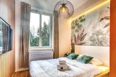 Un ou plusieurs lits dans un hébergement de l'établissement L'Oasis - Bel appart climatisé quartier point du jour Lyon 5