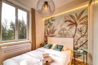 Un ou plusieurs lits dans un hébergement de l'établissement L'Oasis - Bel appart climatisé quartier point du jour Lyon 5