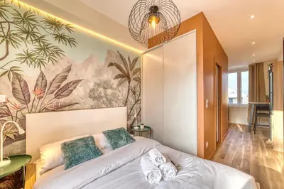 Un ou plusieurs lits dans un hébergement de l'établissement L'Oasis - Bel appart climatisé quartier point du jour Lyon 5