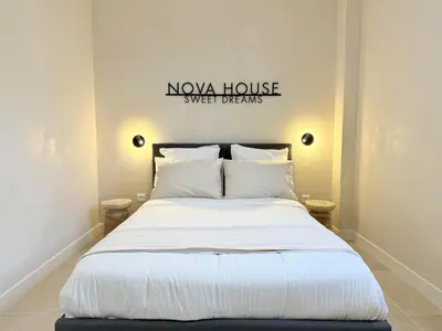 Un ou plusieurs lits dans un hébergement de l'établissement NOVA House T2
