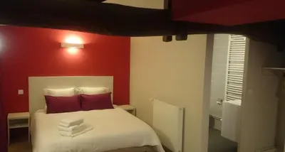 Un ou plusieurs lits dans un hébergement de l'établissement Hôtel Restaurant Carpe Diem