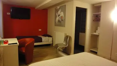 Un ou plusieurs lits dans un hébergement de l'établissement Hôtel Restaurant Carpe Diem
