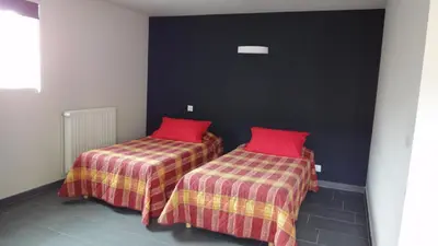 Un ou plusieurs lits dans un hébergement de l'établissement Hôtel Restaurant Carpe Diem