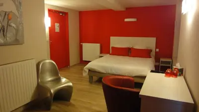 Un ou plusieurs lits dans un hébergement de l'établissement Hôtel Restaurant Carpe Diem