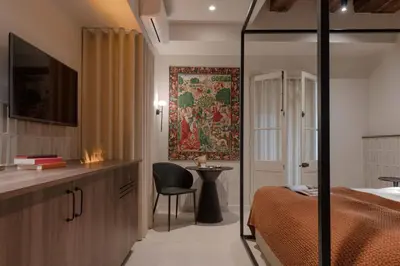 Télévision ou salle de divertissement dans l'établissement MiHotel - Grenier à Sel de Pérouges