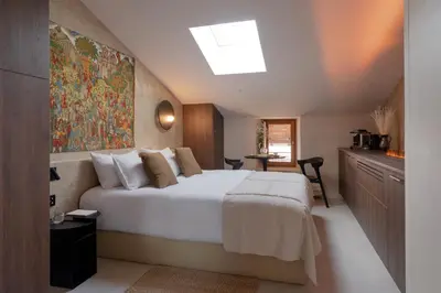 Un ou plusieurs lits dans un hébergement de l'établissement MiHotel - Grenier à Sel de Pérouges