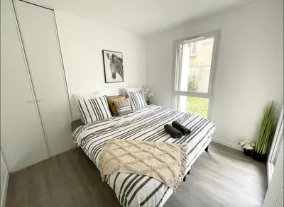 Un ou plusieurs lits dans un hébergement de l'établissement Appartement - Le Salengro