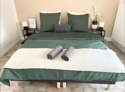Un ou plusieurs lits dans un hébergement de l'établissement Apartment - Le Melies