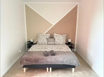Un ou plusieurs lits dans un hébergement de l'établissement Apartment - Le Melies