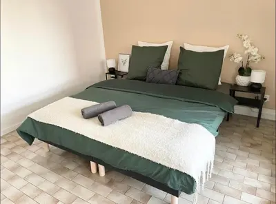Un ou plusieurs lits dans un hébergement de l'établissement Apartment - Le Melies