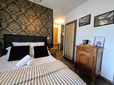Un ou plusieurs lits dans un hébergement de l'établissement Le Clos des Roses - Chambre d'hôtes