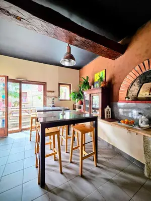 Cuisine ou kitchenette dans l'établissement Le Clos des Roses - Chambre d'hôtes