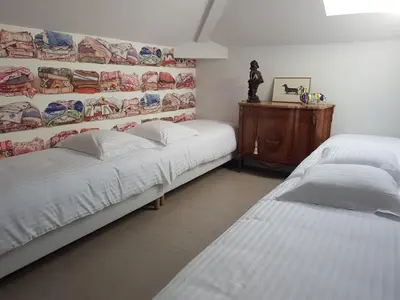 Un ou plusieurs lits dans un hébergement de l'établissement Lyon 4e Croix Rousse Maison complète Jardin