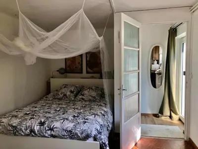 Un ou plusieurs lits dans un hébergement de l'établissement Studio calme avec terrasse proche de Lyon