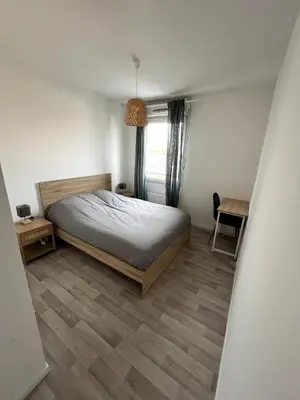 Un ou plusieurs lits dans un hébergement de l'établissement Charming T3 - Garage - Balcon