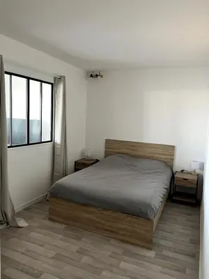 Un ou plusieurs lits dans un hébergement de l'établissement Charming T3 - Garage - Balcon