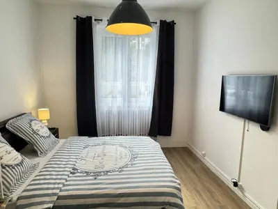 Un ou plusieurs lits dans un hébergement de l'établissement Cosy & Design