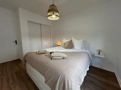 Un ou plusieurs lits dans un hébergement de l'établissement Le cosy clem