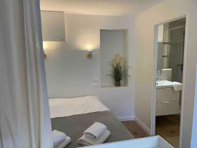 Un ou plusieurs lits dans un hébergement de l'établissement Le Minimaliste, Appartement Hyper Centre Climatisé