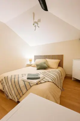 Un ou plusieurs lits dans un hébergement de l'établissement L 'Écrin de Trévoux 3 Chambres confort