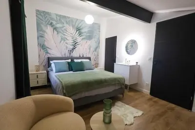 Un ou plusieurs lits dans un hébergement de l'établissement Mi Amore- Gîte 3 suites près de Lyon, parking free