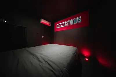Un ou plusieurs lits dans un hébergement de l'établissement Cinéma & Expérience 4K - Popcorn OFFERT
