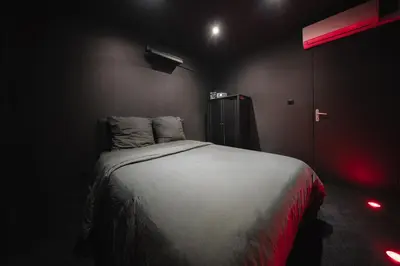 Un ou plusieurs lits dans un hébergement de l'établissement Cinéma & Expérience 4K - Popcorn OFFERT