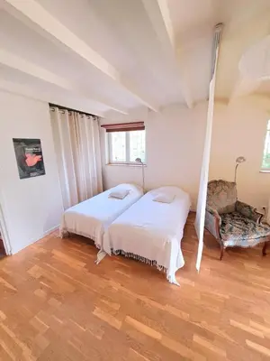 Un ou plusieurs lits dans un hébergement de l'établissement Le Chantegrillet Grand Studio Quiet Garden