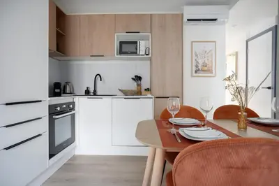 Cuisine ou kitchenette dans l'établissement L'Abri Citadin - Deux chambres
