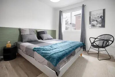 Un ou plusieurs lits dans un hébergement de l'établissement L'Abri Citadin - Deux chambres