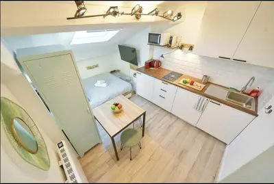 Cuisine ou kitchenette dans l'établissement Sweet Wilson Salengro - droit