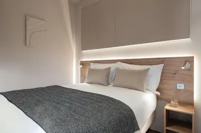 Un ou plusieurs lits dans un hébergement de l'établissement La Suite - Terreaux IV - 2 bedroom with AC