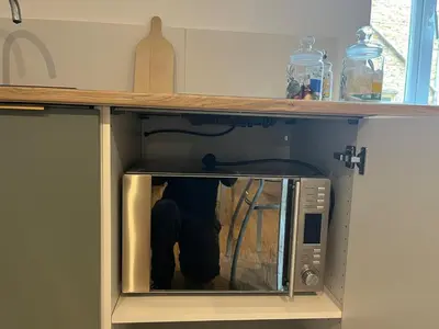 Cuisine ou kitchenette dans l'établissement Studio climatisé