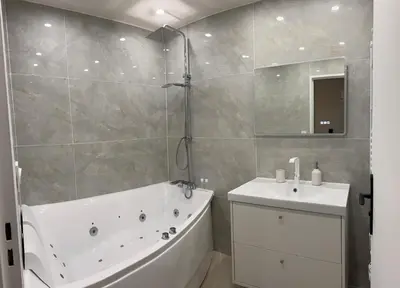 Salle de bains dans l'établissement joli appartement T4