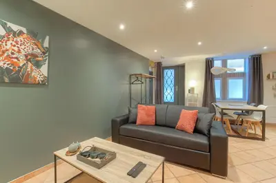 Coin salon dans l'établissement Le Rempart, Appartement Proche Lyon & Villefranche