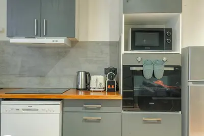 Cuisine ou kitchenette dans l'établissement Le Rempart, Appartement Proche Lyon & Villefranche